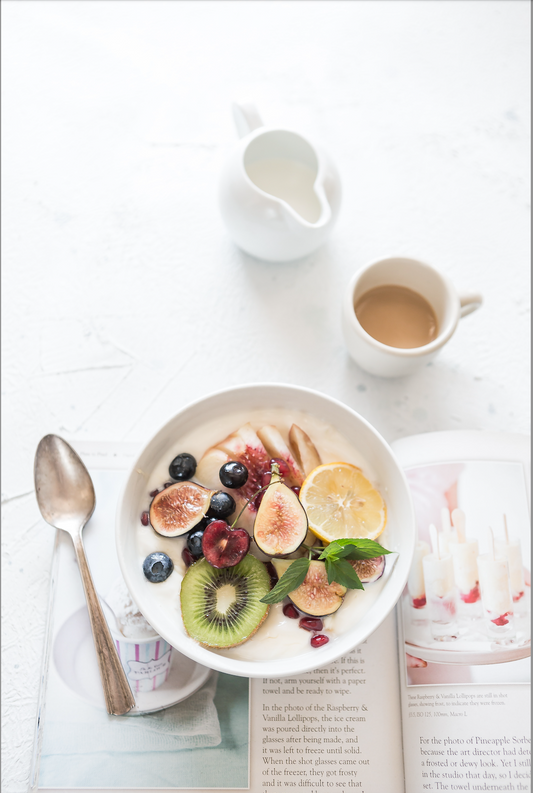 breakfast bowl, coffee and a book. Body Love Book Review: Simplifying Nutrition with Kelly LeVeque